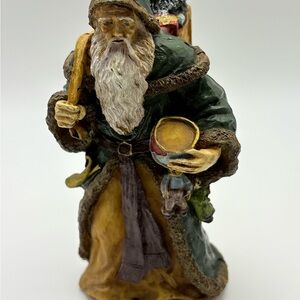 Green Coat Santa Figurine with Drum Carrying Presents Holiday Decor